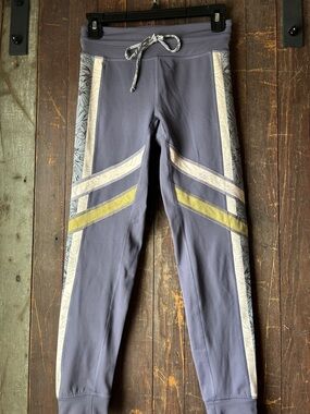 FP Movement by Free People Lavender Track Joggers with Cream & Yellow Accents